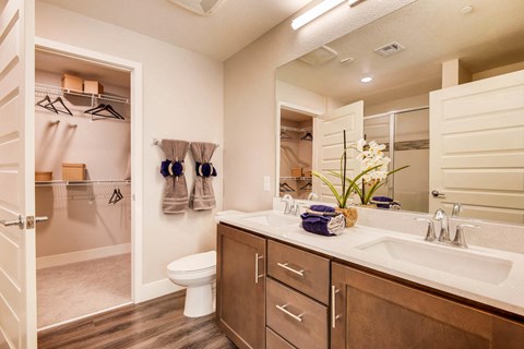 Las Vegas NV Apartments -The Mercer Bathroom With Wooden Flooring and Sleek Cabinets